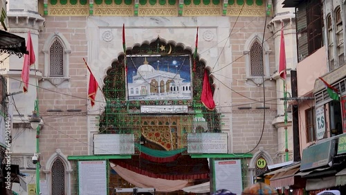 ancient Sufi Tomb of sufi saint Khawaja Moinuddin Chishti dargah with people visiting at day photo