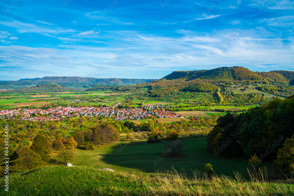 Germany, beautiful view above swabian alb nature landscape bissingen unter teck city houses sun day autumn colorful blue sky