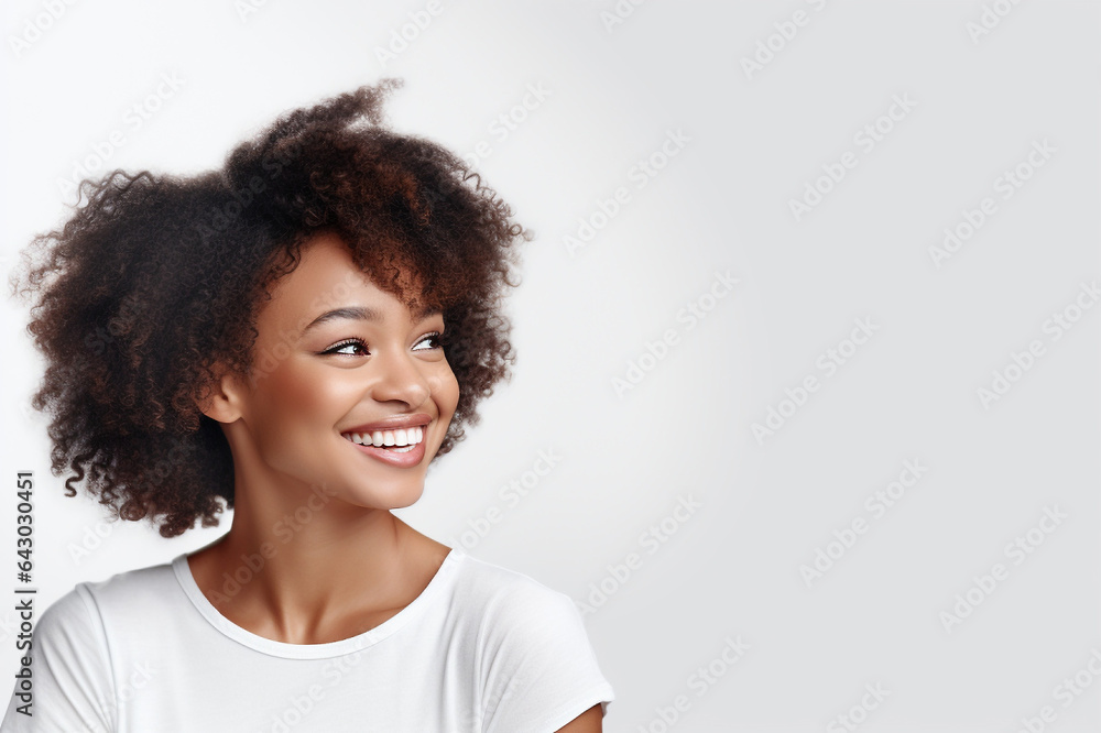 Pretty African American woman in a casual style, her bright teeth complementing her beautiful smile Pretty African American woman in a casual style, her bright teeth complementing her beautiful smile