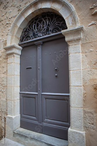 Old wooden door of a classic stone house
