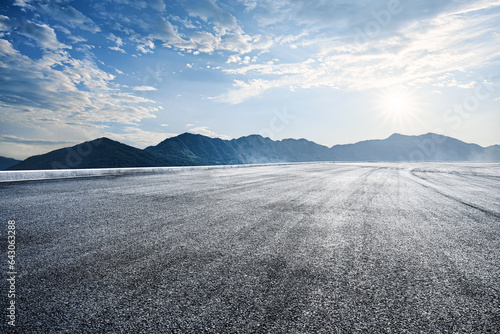 Empty asphalt road and mountains nature scenery at sunrise © zhao dongfang