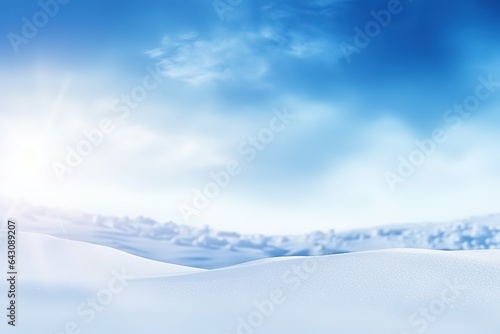 Winter snow background with snowdrifts, with beautiful light and snow flakes on the blue sky, copy space. © arhendrix