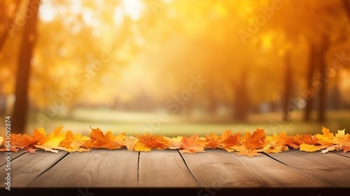 colorful natural autumn background for presentation. Fallen dry orange leaves on wooden boards against the backdrop of a blurry autumn park.