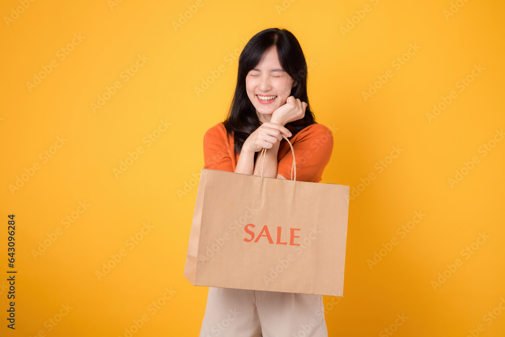 Elevate your shopping experience with love and the best deals. Smiling woman reveals her purchases, capturing the thrill of discovering incredible savings. isolated on yellow background Elevate your shopping experience with love and the best deals. Smiling woman reveals her purchases, capturing the thrill of discovering incredible savings. isolated on yellow background