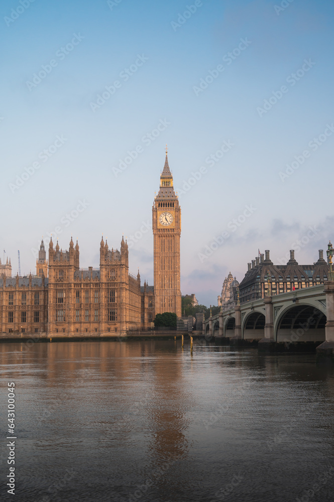 The Big Ben and Houses of Parliament against blue sky - London, UK.Vertical shot