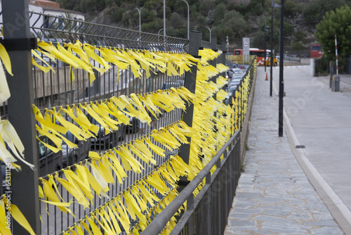 Yellow ribbon ties in Catalonia protest against political prisoners sign photo