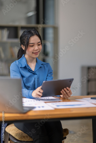 Businesswo man working at office with tablet documents on his desk, doing planning analyzing the financial report, business plan investment, finance analysis concept photo