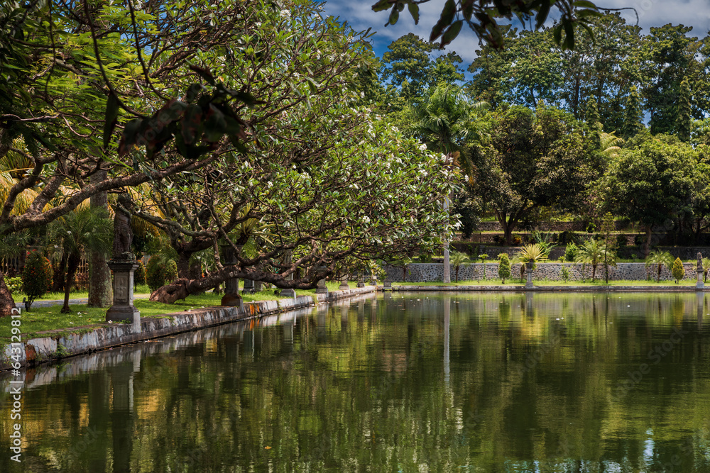 Fototapeta premium Water Palace Taman Ujung in Bali, Indonesia. Tropical park with pond in royal palace
