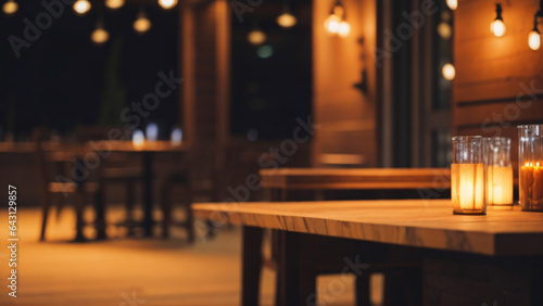 Empty wooden table and chairs in restaurant at night  bokeh background
