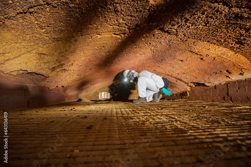 Принти на полотні Male worker inspecting belt refractory bricks of coil heater gas equipment of boiler room