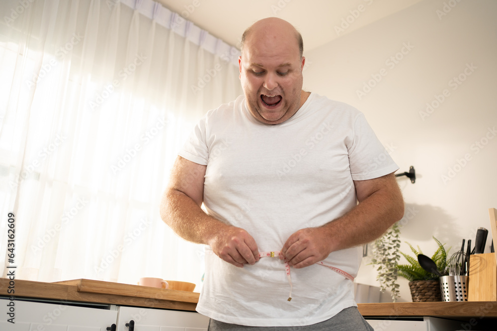 Facing the Facts: Startling Measurement as Overweight Man Checks Belly