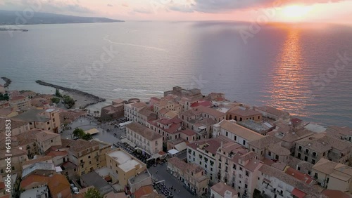 Aerial view from the drone of the beautiful village of Pizzo Calabro overlooking the Caribbean sea of Calabria in Italy. Behind it is the Salerno-Reggio Calabria motorway photo