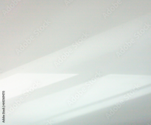 Fototapeta Naklejka Na Ścianę i Meble -  Abstract background of sunlight reflection on white wall. Minimalist background with copy space. Soft focus.