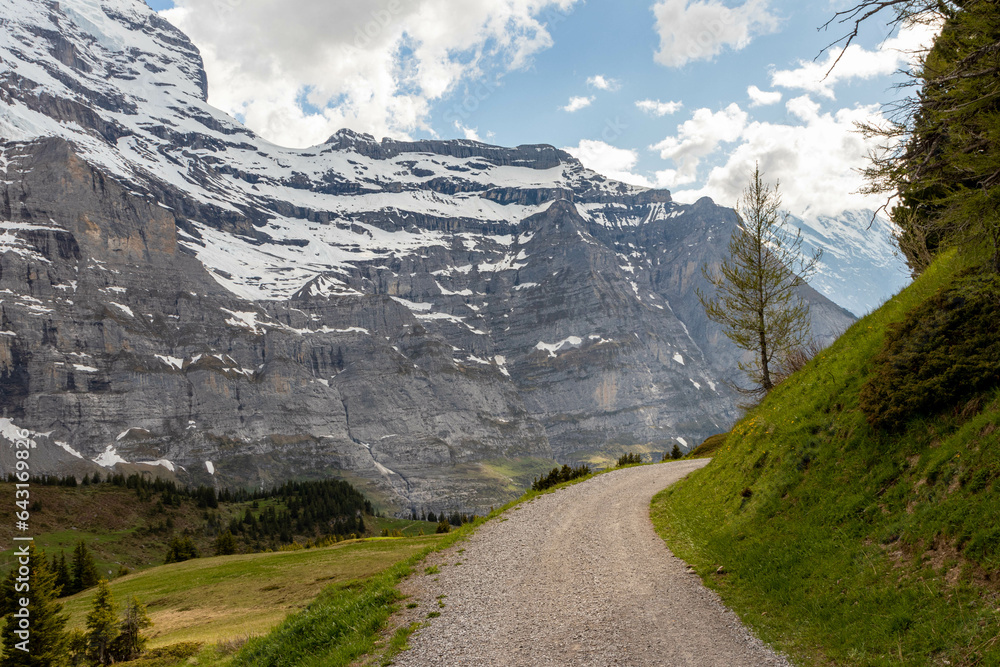 Close Up View of Snow Covered Mountain in the Swiss Alps in the Summer with Clouds in the Background in Switzerland Close Up View of Snow Covered Mountain in the Swiss Alps in the Summer with Clouds in the Background in Switzerland