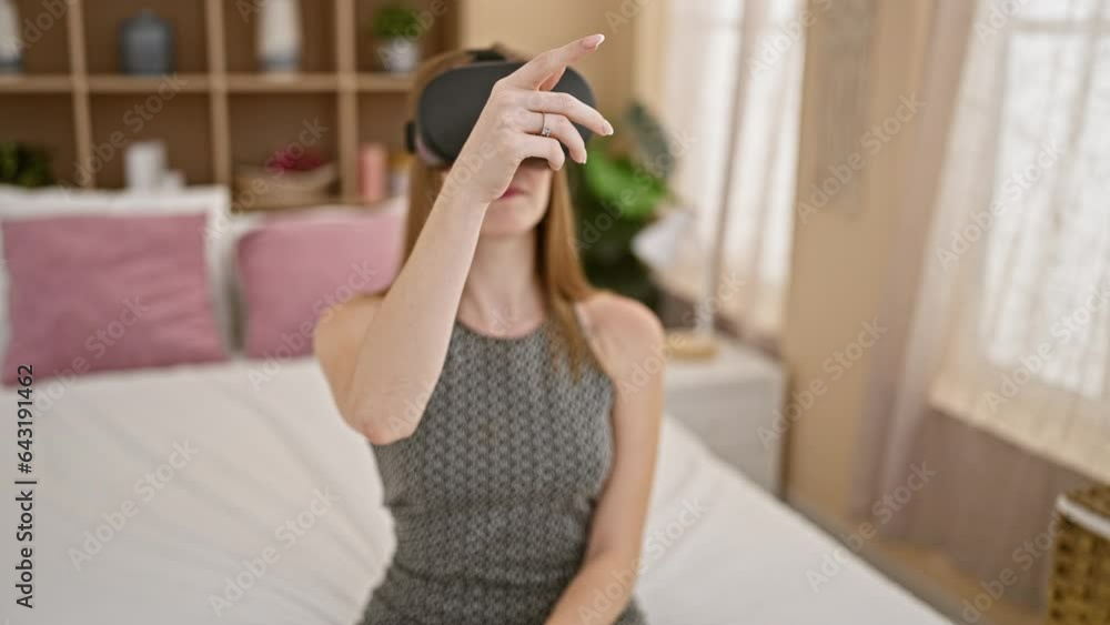 Young blonde woman taking virtual reality glasses off relaxed on bed at bedroom Young blonde woman taking virtual reality glasses off relaxed on bed at bedroom