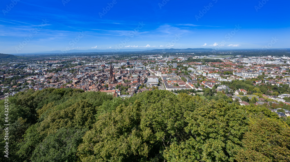 Freiburg im Breisgau. View over the roofs of the old town with Freiburg Cathedral. Baden-Wuerttemberg, Germany, Europe