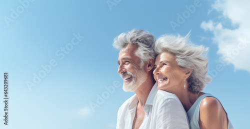 Happy smiling mature senior couple on the beach