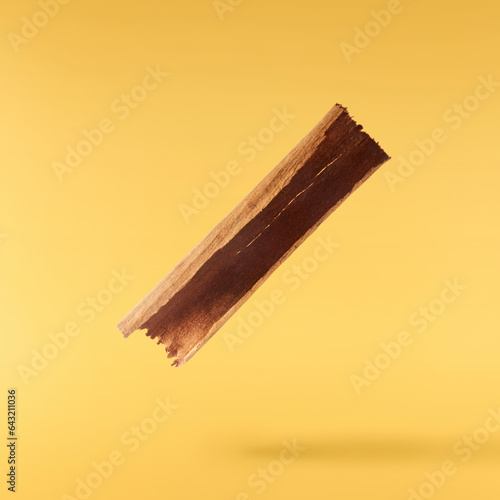 Fresh dried raw Cinnamon stick falling in the air