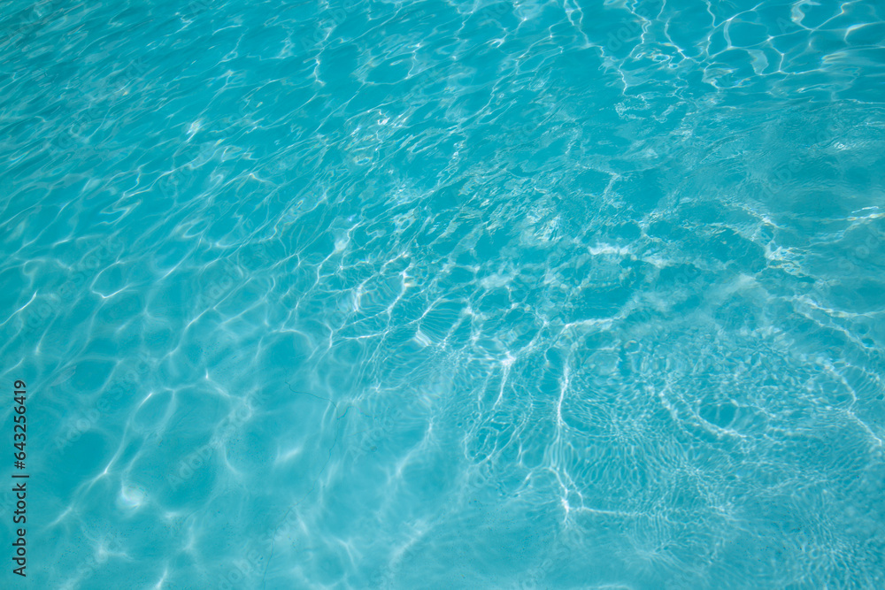 Pool water, cool blue, filling the entire frame. High resolution background or texture asset.