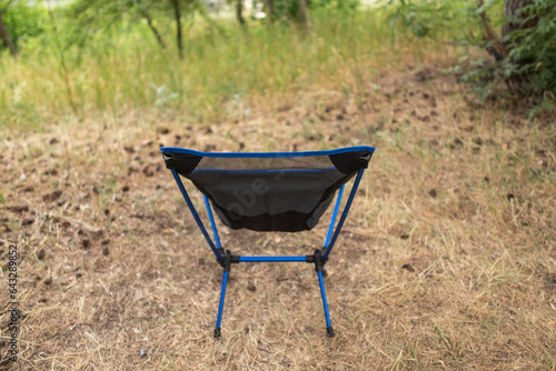 trekking folding chair blue in the forest