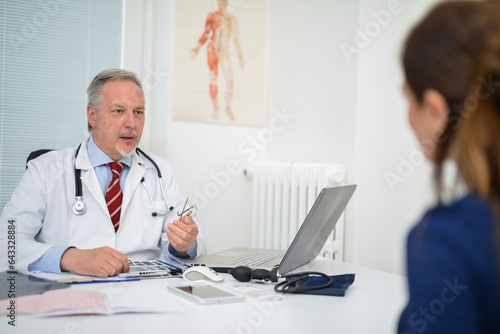 Businessman talking to a patient