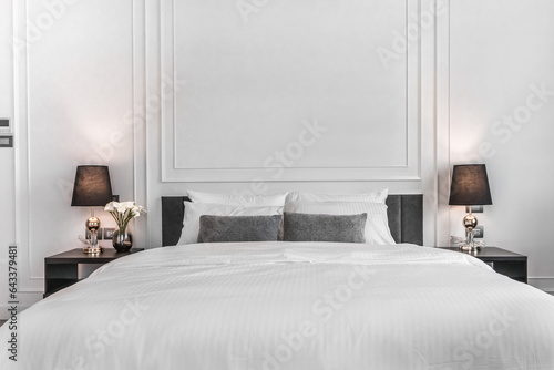 Big bed with comfortable in a luxurious white bedroom with a cozy style at a penthouse