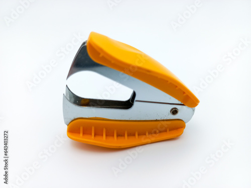 Orange Staple Remover Isolated On White Background. Side View