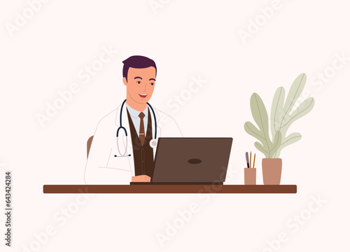 One Smiling Male Doctor Working On Laptop. Half Length.