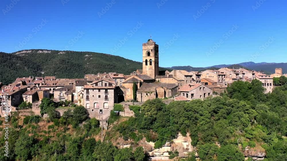 Drone shot, drone video, drone flight, aerial view, flight over the historic old town with castle, castle and church of Ainsa, view of the mountains of the Pyrenees, close-up, province of Huesca Drone shot, drone video, drone flight, aerial view, flight over the historic old town with castle, castle and church of Ainsa, view of the mountains of the Pyrenees, close-up, province of Huesca