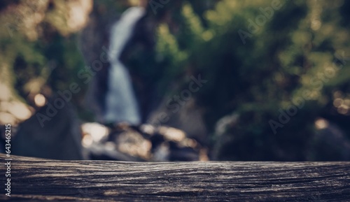 Wooden surface on the background of waterfall  © avtk
