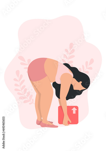 A pregnant woman is bending down to lift the box.
