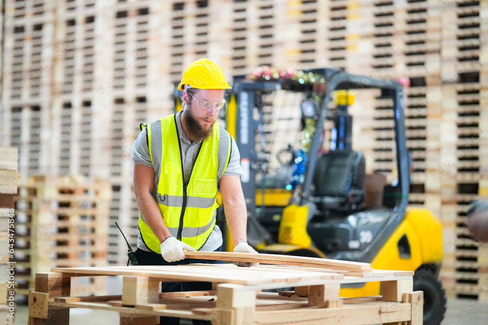 Industrial factory employee working in wooden manufacturing industry Industrial factory employee working in wooden manufacturing industry
