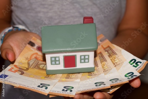 Model house with euro banknotes photo