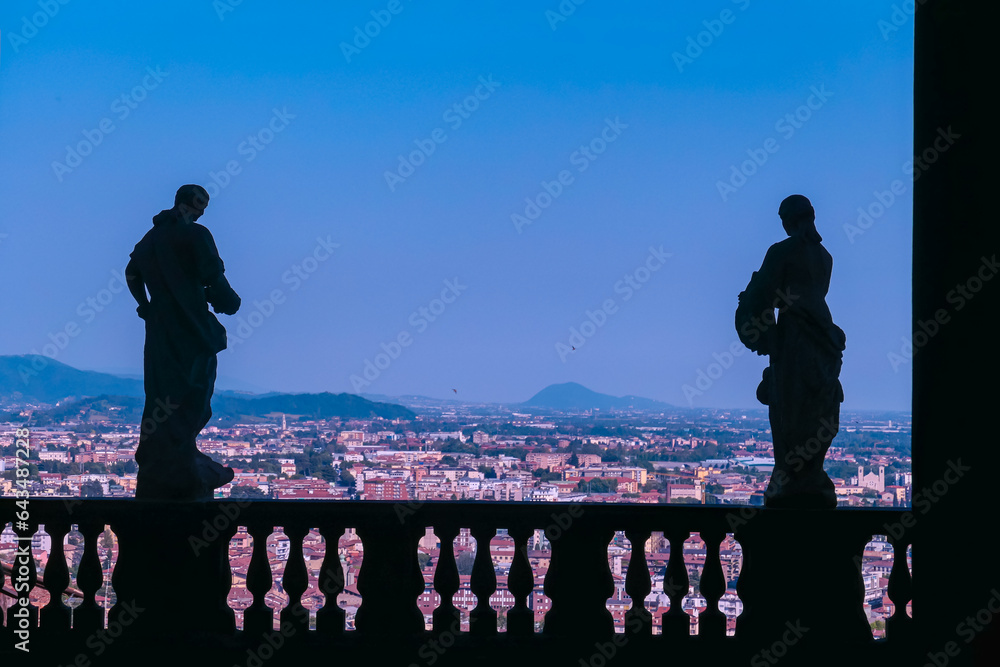Silhouette view of gate and statues on the terrace of Palazzo Terzi, Bergamo, Lombardy, Italy. Baroque building behind Santa Maria Maggiore in the Città Alta (upper town)