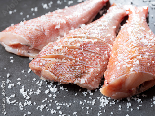 Red rockfish sprinkled with coarse salt photo