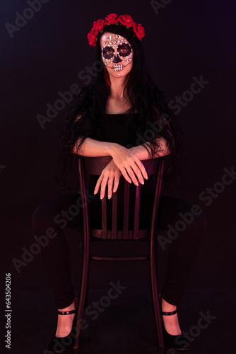 woman look as Death sit on chair and spread legs