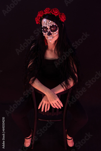woman look as Death sit on chair and spread legs