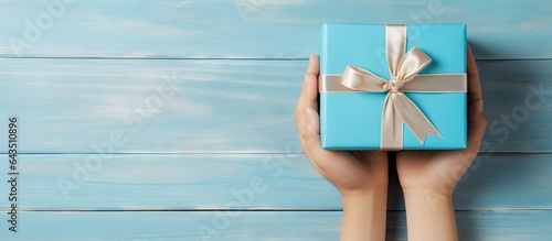 Kid s blue gift box on tabl...