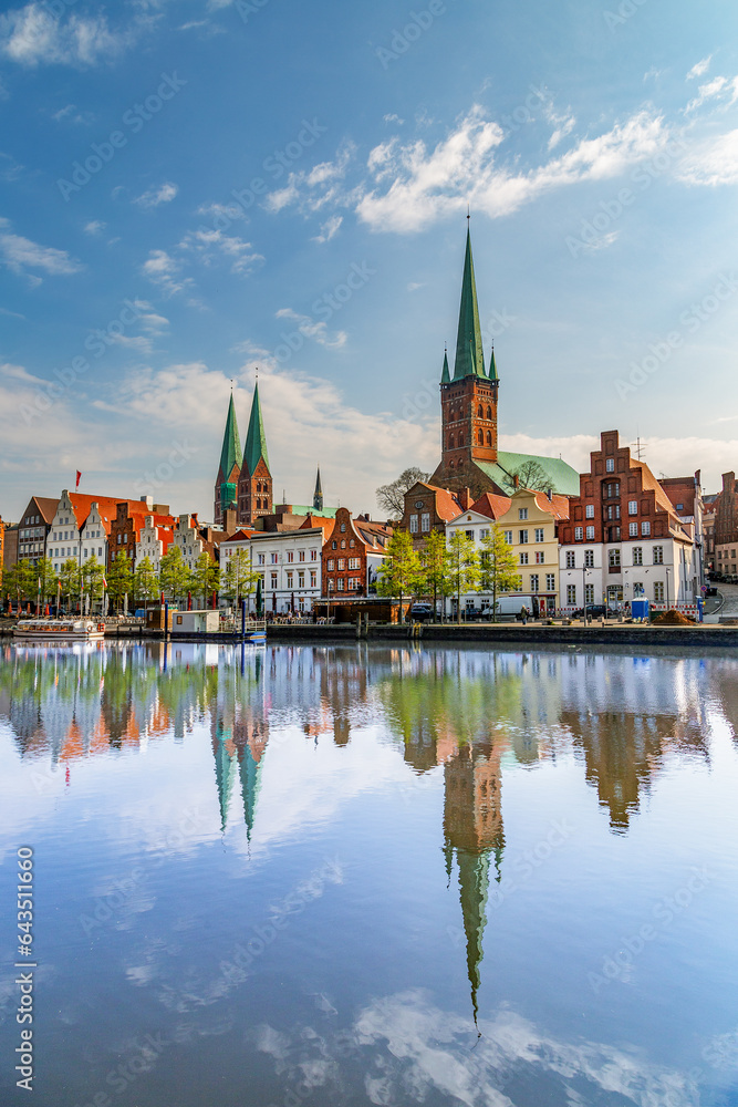 reflection of old bbrickstone buildings in river Peene in Lübeck, Germany reflection of old bbrickstone buildings in river Peene in Lübeck, Germany