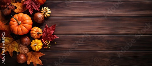 Wallpaper Mural Autumn themed decoration with leaves pumpkins and a wooden background Top view with space for text Torontodigital.ca