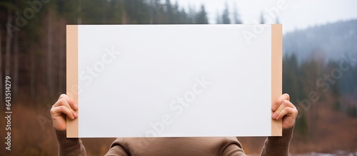 Person holding blank sign i...