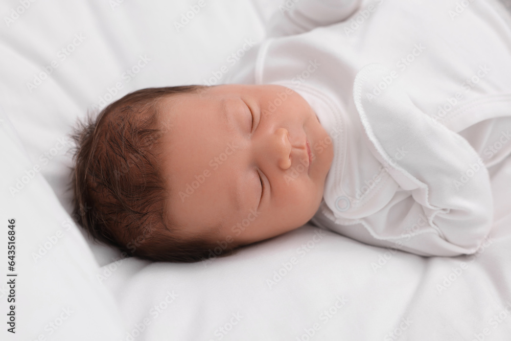 Cute newborn baby sleeping on white bed Cute newborn baby sleeping on white bed