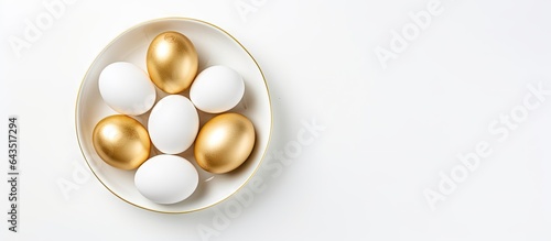 White eggs adorned with gol...