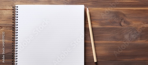 School supplies including a notebook and pencil on a gray table Overhead view Room for writing