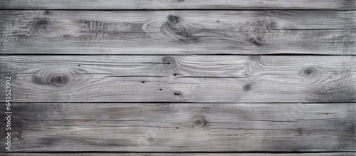 Textured grey wooden board with room for copy on aged backdrop