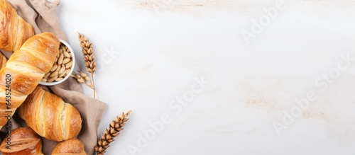 Top view of fresh pastries and rolls on a light background showcasing culinary backgrounds