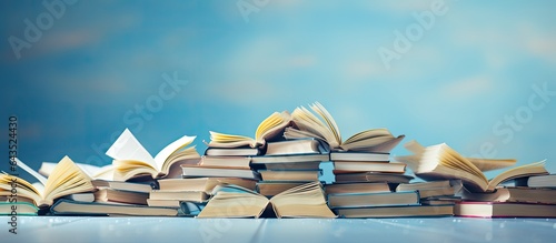 A pile of books with an ope...