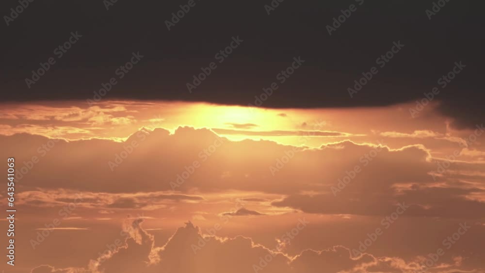 Timelapse of the evening sunset with clouds.