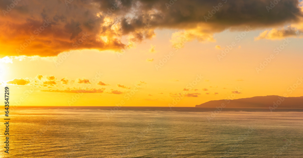 scenic landscape of colorful sunset or sunrise above water, evening or morning seascape