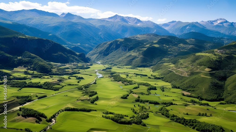 Beautiful aerial view of the majestic aragon pyrenees mountains in Bisaurin, Spain. The mountains are draped in green grass.